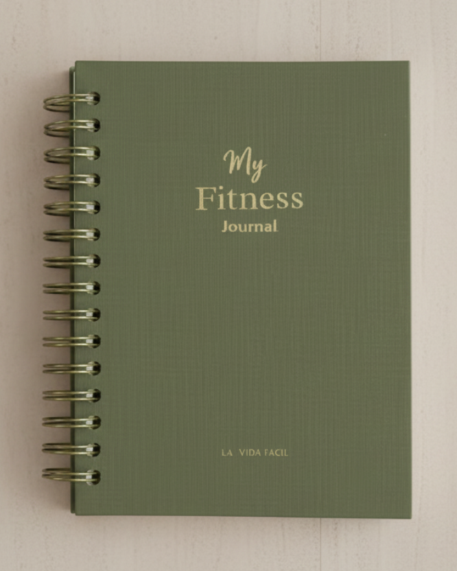 Green fitness journal with 'My Fitness Journal' text on a marble background