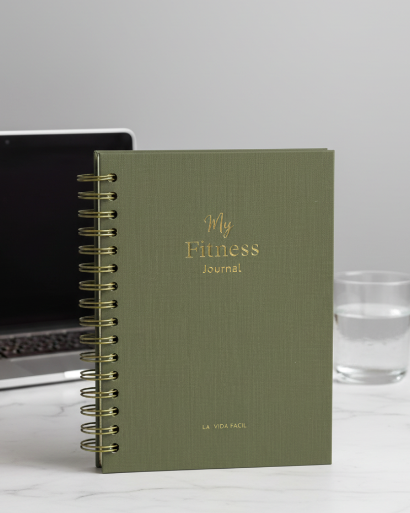 Green fitness journal with 'My Fitness Journal' text on a marble background