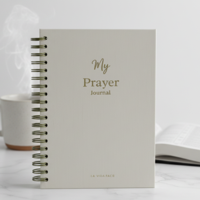 Gray spiral-bound journal with 'My Prayer Journal' text on a white background